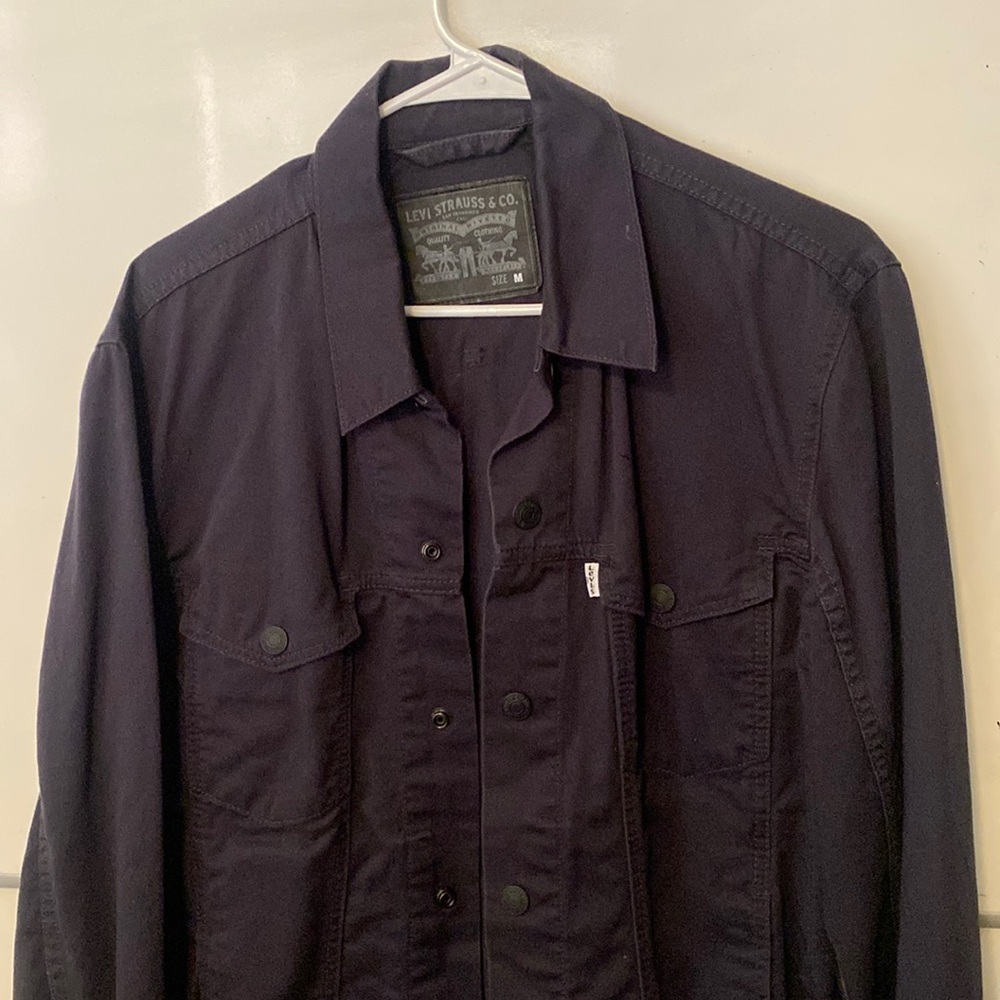 Levi’s canvas “Jean jacket” dark navy blue.
